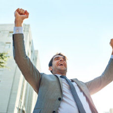 corporate man celebrating freedom from debt