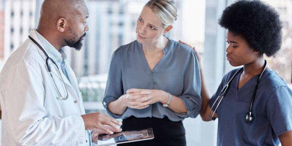 Tablet, doctors and business woman planning, healthcare service and management, schedule and teamwork. Nurse, medical professional and people on digital technology for feedback or hospital data.